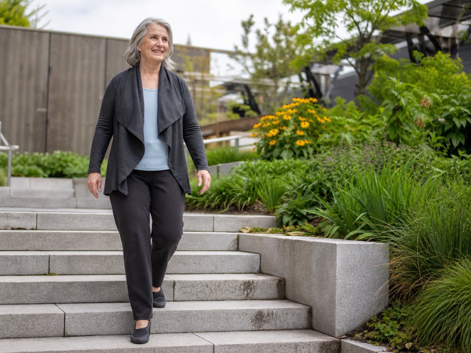 An older adult walking down outdoor steps